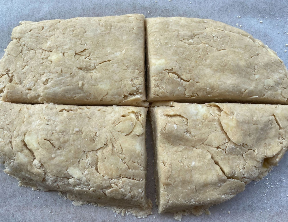 Biscuit dough cut in 4 pieces